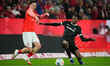 Anthony Caci of FSV Mainz 05 and Johan Manzambi of SC Freiburg compete for the ball during...