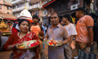 Nepali Hindu revelers participate in a ritualistic celebratory parade during the annual Si...