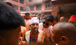 Sujan Bagh Shrestha wears white turf and greets the crowd after participating in the tongu...