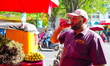 People consume street beverages such as rose sharbat, fruit soda, sugarcane juice, and lem...