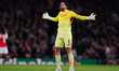 Arsenal goalkeeper David Raya interacts with fans during the UEFA Champions League Quarter...