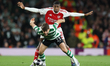 Daniel Braganca of Sporting Clube de Portugal is pressured by Cristhian Mosquera of Arsena...