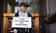 People protest outside the Internal Revenue Service (IRS) Building in New York City, Unite...
