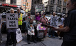 People protest outside the Internal Revenue Service (IRS) Building in New York City, Unite...