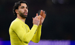 Arsenal goalkeeper David Raya applauds home support at full time during the UEFA Champions...