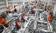 Robots produce automotive body sheet metal products in the production workshop of a mold s...