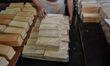 ''Roti Sultan'' white bread is arranged on a packing table by a worker at a home industry...