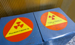 Containers are marked with radiation signs, or trefoils, at the Reactor 3 Main Control Roo...