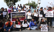 Students affiliated with various unions stage a protest at Maitighar Mandala in Kathmandu,...