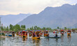 Kashmiri men row boats carrying banners that read ''No to Drugs, Yes to Life'' during a dr...