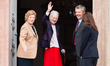 Queen Margrethe of Denmark waves to members of the public on her 86th birthday at the Inne...