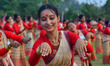 Assamese girls wearing traditional Mekhela Chadar perform the Bihu folk dance during the R...