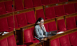 Manon Bouquin, a deputy of the Rassemblement National parliamentary group, wears a headpho...