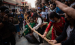 Newari women pull Lord Bhairav's chariot in Bhaktapur, Nepal, on Thursday. Biska Jatra, ce...