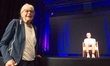 Eva Weyl, a Holocaust witness, stands in front of a digital hologram of herself at the Zec...