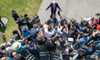 President Trump takes questions from the White House Press Corps as he boards his helicopt...