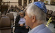 Iranian-Jewish men participate in a prayer ceremony commemorating the death of Iran's late...