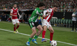Florian Grillitsch of SC Braga competes for the ball with Hector Bellerin of Real Betis du...