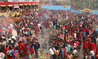 Nepali Hindu devotees circumnavigate the Mata Tirtha Temple located in a hill station on t...