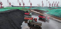 Editorial photo: Transport vehicles move imported coal unloaded from cargo ships at Lianyungang Port Coal Terminal in Jiangsu Province, China, on April 17, 2026.  by Costfoto/NurPhoto