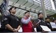 Members of the Samsung Group Super Union hold a press conference in front of the Samsung E...