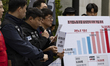 Members of the Samsung Group Super Union hold a press conference in front of the Samsung E...