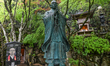 MIYAJIMA, JAPAN - APRIL 15: 
 A bronze statue and commemorative plaque dedicated to the 7...