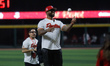 Jose Reyes, former shortstop for the New York Mets, throws the ceremonial first pitch of t...