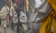 MIYAJIMA, JAPAN - APRIL 15: 
 Devotees and pilgrims walk barefoot through thick smoke and...