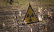 A radiation sign, or trefoil, marks the territory of the Temporary Radioactive Waste Local...