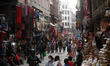 People move through the bustling lanes of Asan Market in Kathmandu, Nepal, on April 17, 20...
