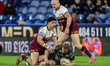 Jacob Gagai tackles Lachie Miller during the BetFred Super League match between Huddersfie...