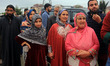 Relatives bid farewell to Hajj pilgrims as they begin their journey from Srinagar, India,...