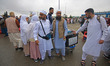 Men and women Hajj pilgrims from Kashmir arrive at the Hajj house as they begin their spir...