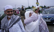 Kashmiri Muslim Hajj pilgrims bid farewell at the Hajj House before departing for the annu...