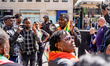 Former political detainees Makomborero Haruzviseh and Shepherd Yuda stand outside the Zimb...
