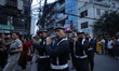 The traditional band of the Nepali Army plays the flute during a procession on the first d...