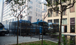 Participants in an anti-fascist march encounter a police checkpoint with grates and crowd-...