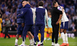 Roberto De Zerbi, manager of Tottenham Hotspur, consoles Kevin Danso of Tottenham Hotspur...