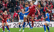 Cristiana Girelli of Italy and Cecilie Floe of Denmark compete in a header duel during the...