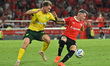Matias Abaldo, an Independiente player, contests the ball with a Defensa y Justicia player...