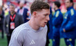 Elliot Anderson of Nottingham Forest holds a shirt with his mother's name on the back duri...