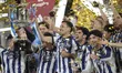 Mikel Oyarzabal centre-forward of Real Sociedad and Spain lifts the trophy after winning w...