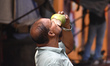 A person drinks tender coconut water during the heatwave in Kolkata, India, on April 19, 2...