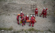 Members of the Iranian Red Crescent Society's search-and-rescue team participate in a trai...