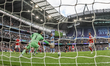 Rayan Cherki of Manchester City scores to make it 1-0 during the Premier League match betw...