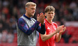 Joe Worrall of Burnley and Ryan Yates of Nottingham Forest applaud the Nottingham Forest s...