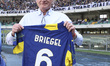 Italo Zanzi, CEO of Hellas Verona FC, presents a shirt to Hans Peter Brigel before the Hel...