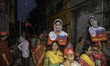 Women supporters of the Communist Party of India (Marxist) participate in a road show with...