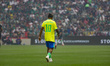 Brazilian former football player Ronaldinho looks on during the legends exhibition footbal...